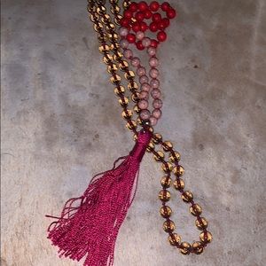 Tassel beaded necklace in shades of red/pink